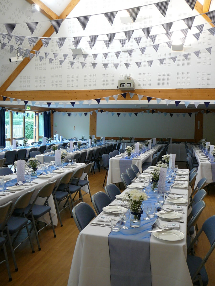 Petham Village Hall, tables laid in blue for meal